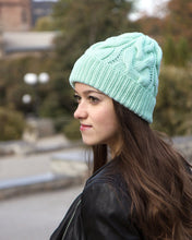 mint green knitted hat with braids