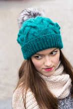 teal woolly hat with pom pom