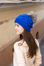 cobalt blue cable knit hat with real fur bobble